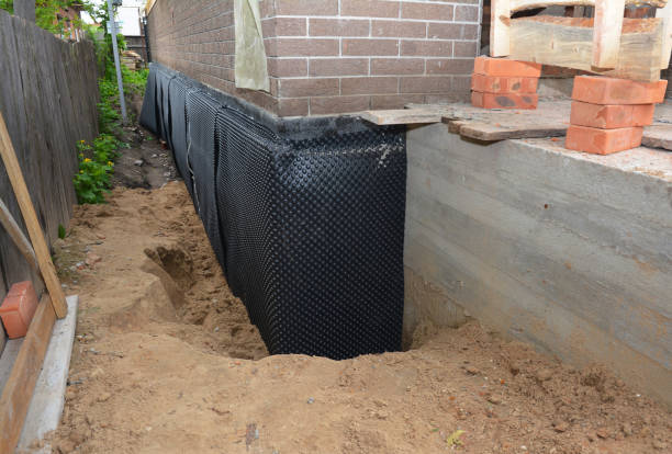 Happy homeowners after waterproofing job in Goldsmith